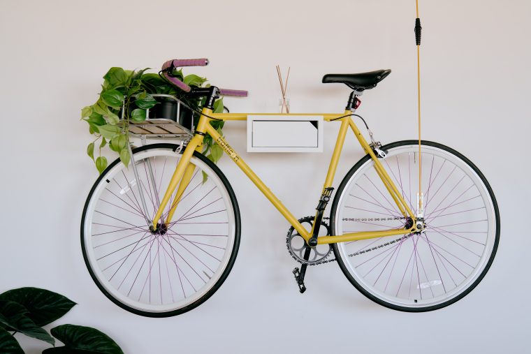 yellow bike mounted to the walls of the trafficon office